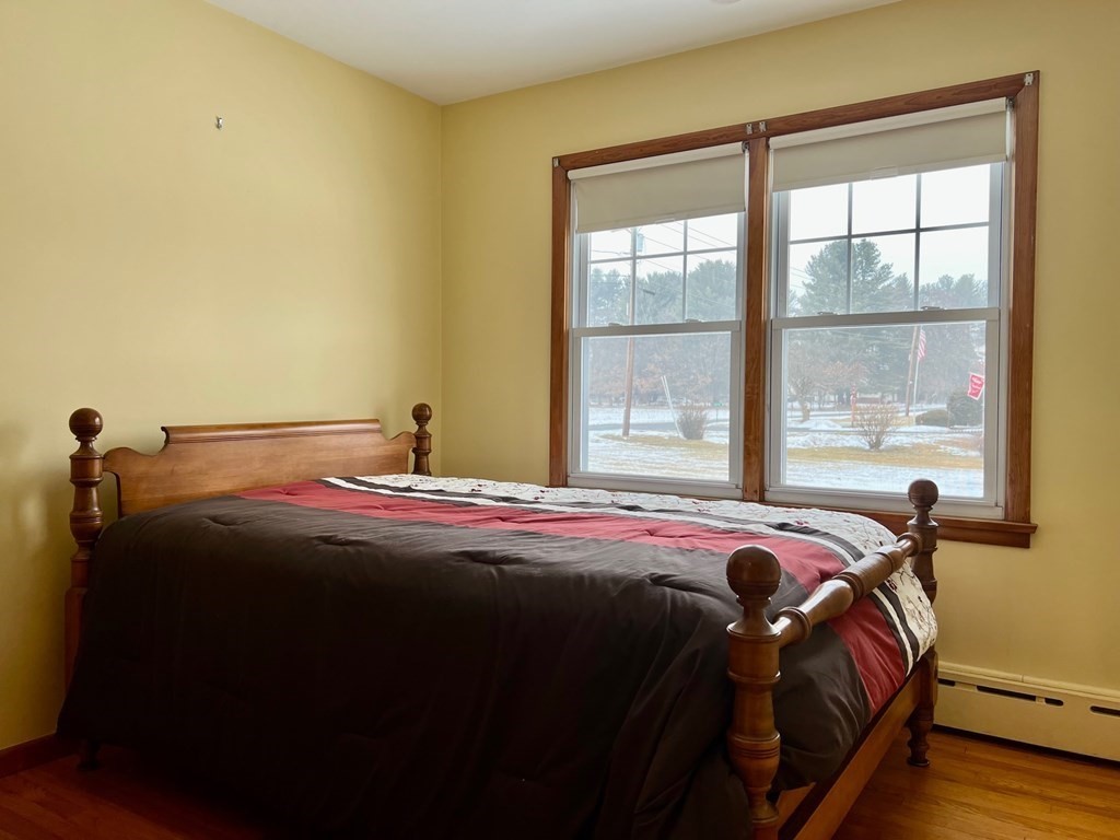 128 Depot Road Hatfield, MA 01038 - Photo 18 of 23 a bedroom with a bed and a window