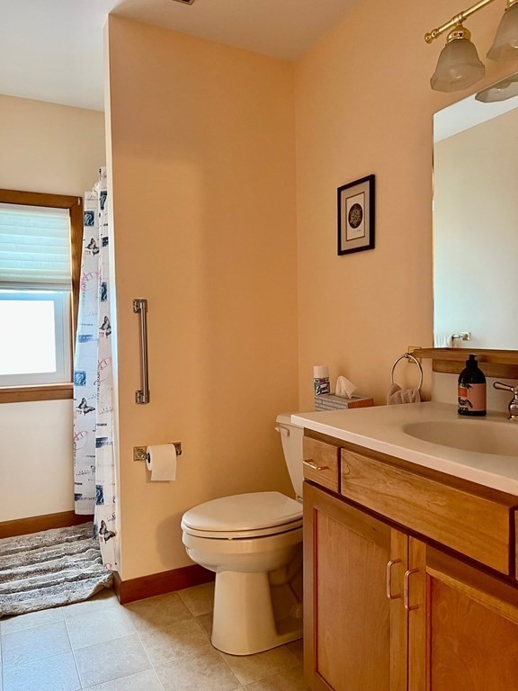 128 Depot Road Hatfield, MA 01038 - Photo 20 of 23 a bathroom with a granite countertop toilet and a sink
