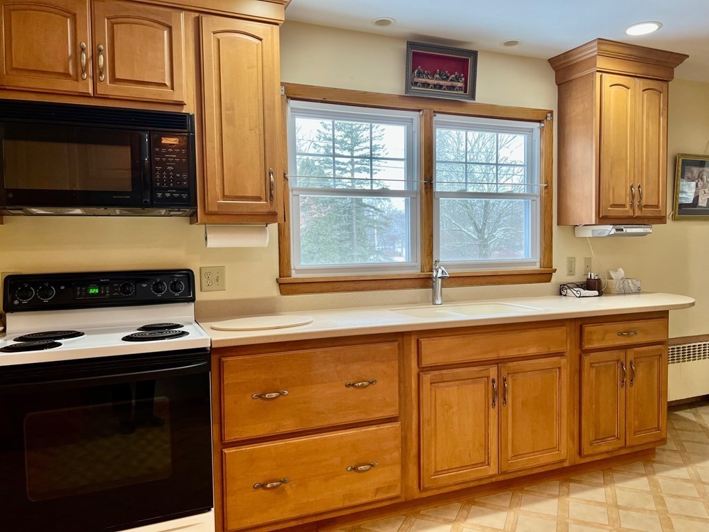 128 Depot Road Hatfield, MA 01038 - Photo 7 of 23 a kitchen with stainless steel appliances a stove and a microwave