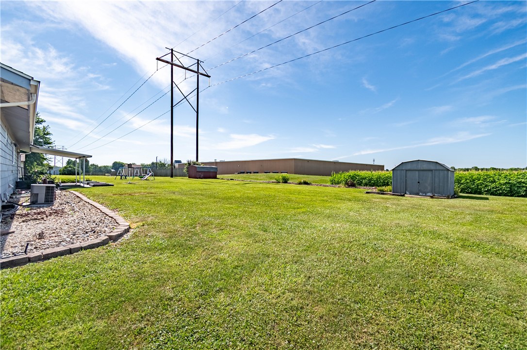 1823 Cooper Drive Decatur, IL 62526 - Photo 19 of 21 a view of a building with a big yard