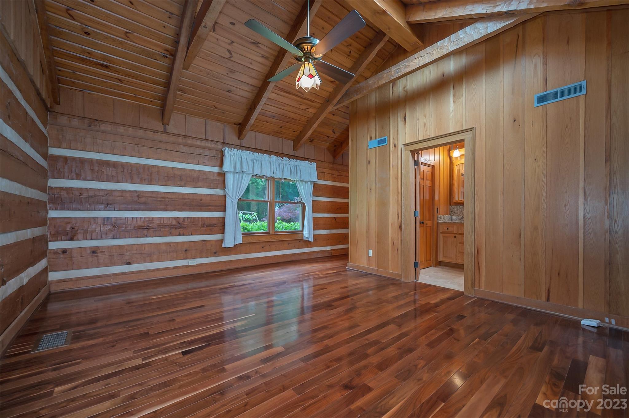 251 Painters Gap Road Rutherfordton, NC 28139 - Photo 20 of 48 a view of an empty room with wooden floor and a window