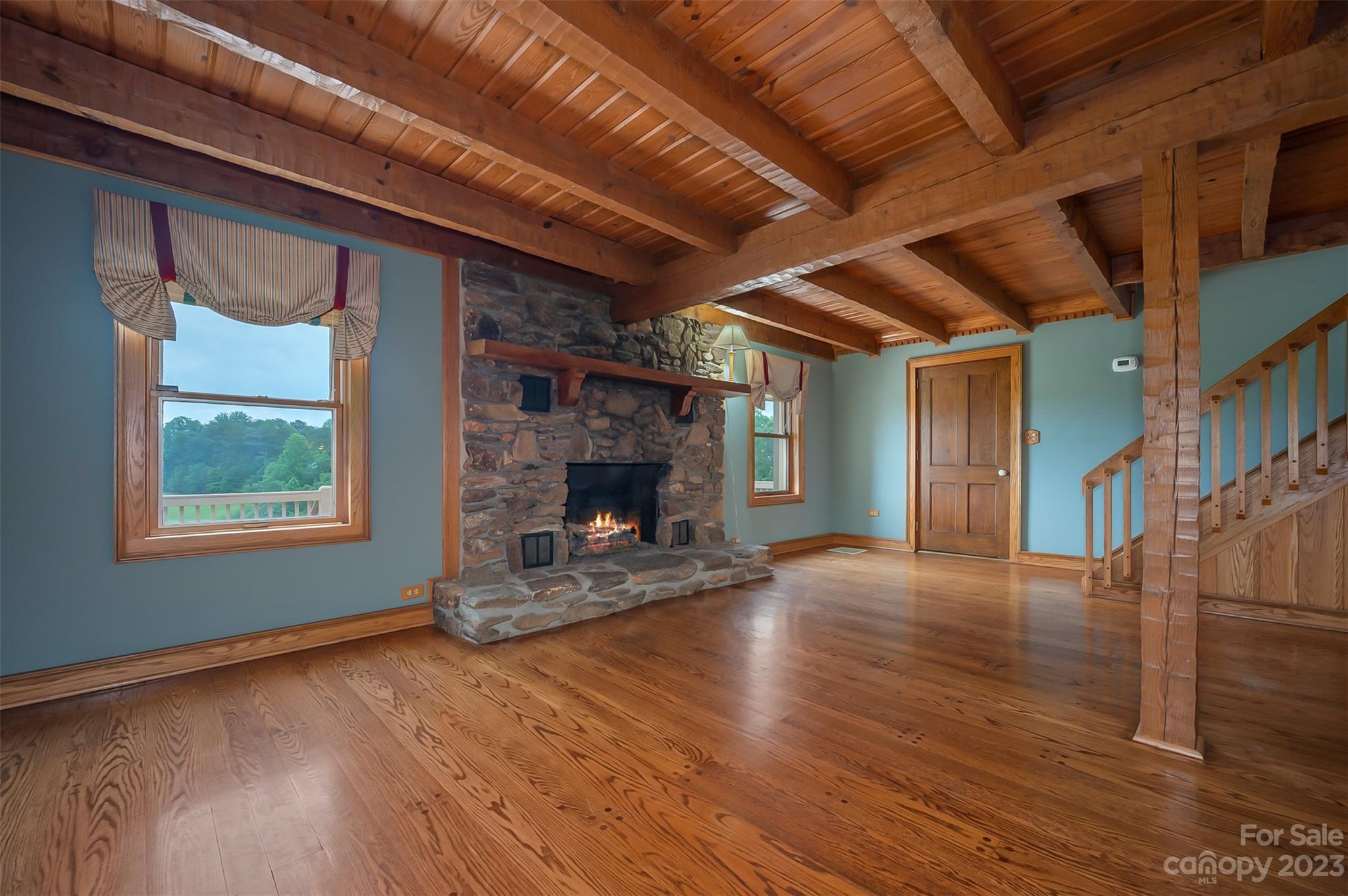 251 Painters Gap Road Rutherfordton, NC 28139 - Photo 8 of 48 a view of empty room with wooden floor and fireplace