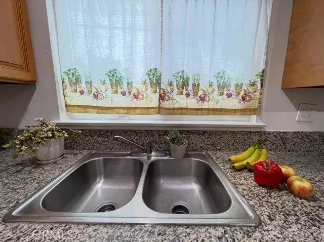 a kitchen with a sink and a stove