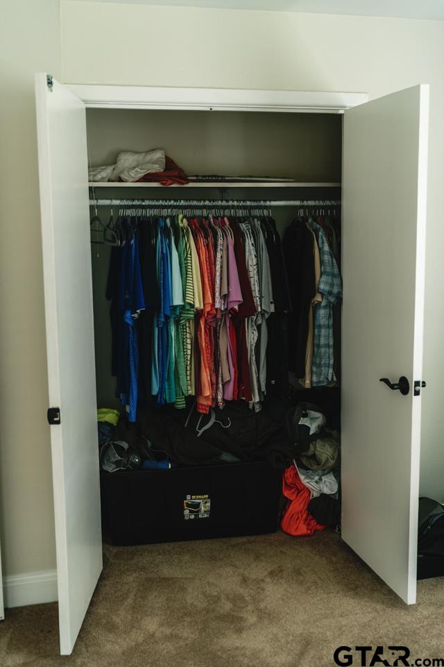 2411 Rodge Drive Tyler, TX 75701 - Photo 24 of 42 a view of walk in closet with clothes and shoes
