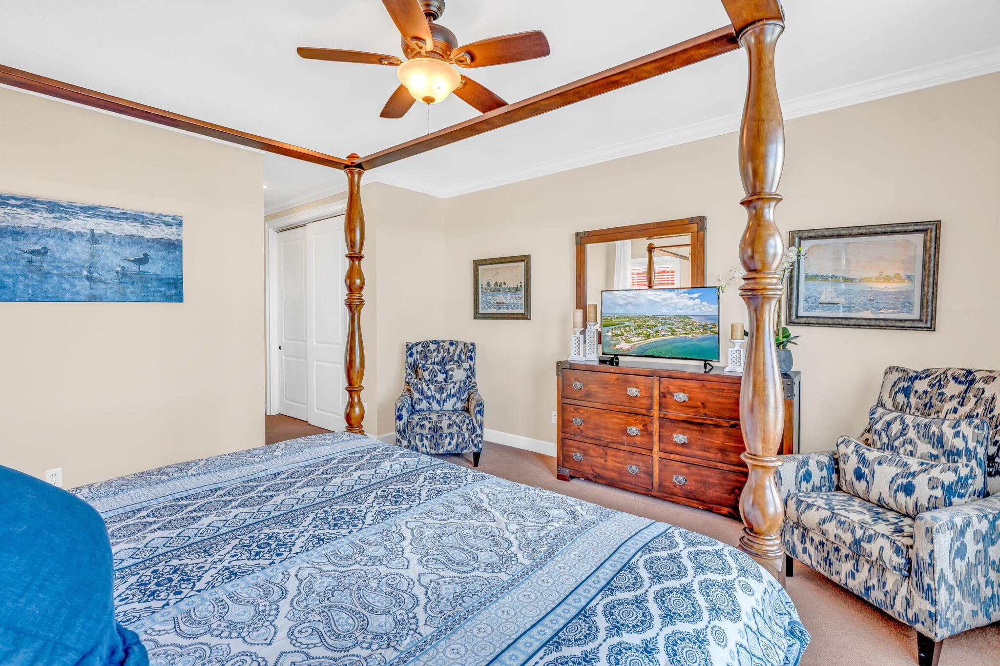 231 Sombrero Beach Road, Unit 1 Marathon, FL 33050 - Photo 13 of 52 a bedroom with bed and wooden cabinets