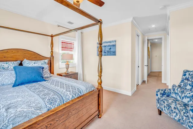 a bedroom with a large bed and a couch