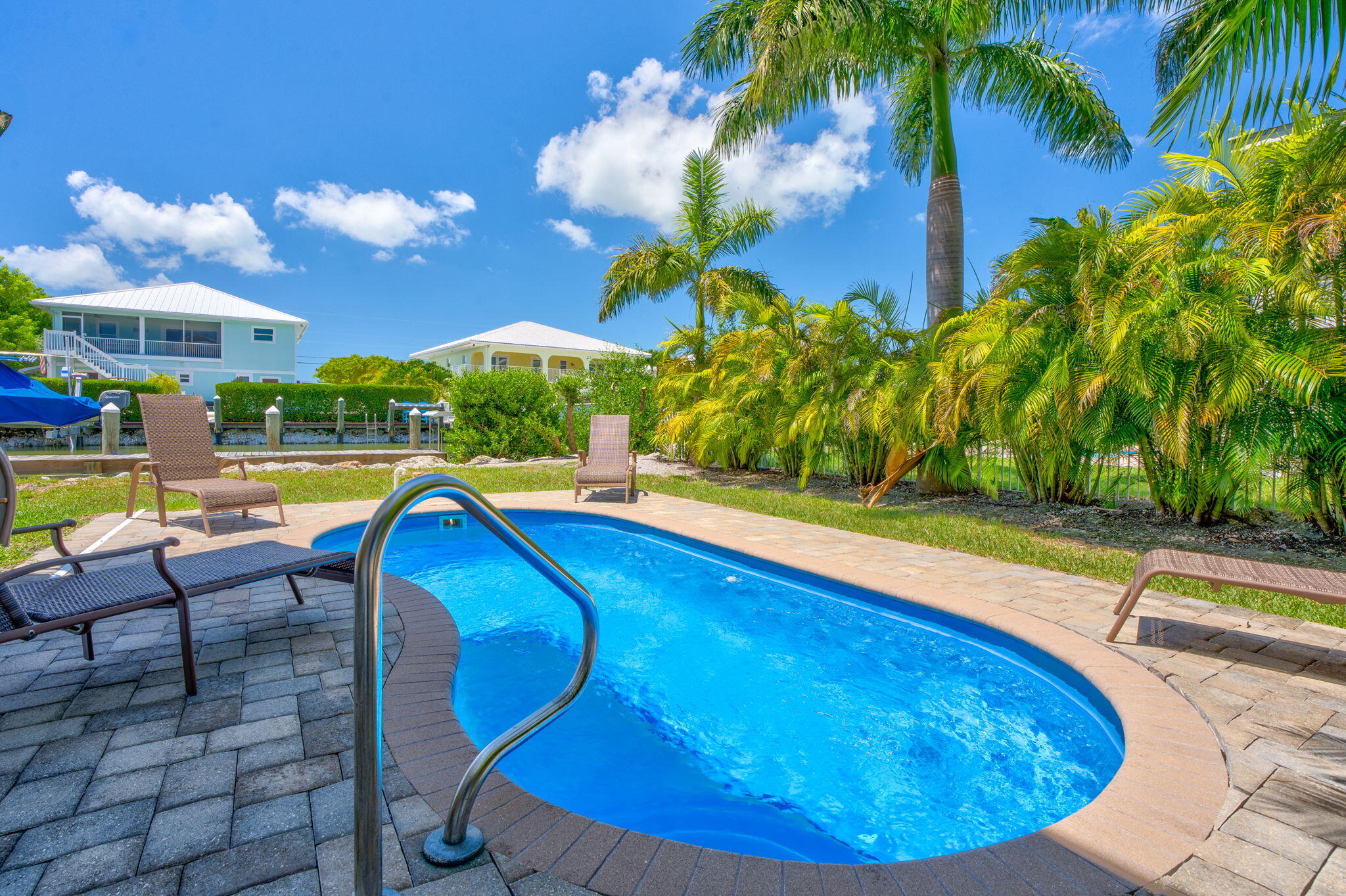 231 Sombrero Beach Road, Unit 1 Marathon, FL 33050 - Photo 2 of 52 a view of a swimming pool with lounge chair