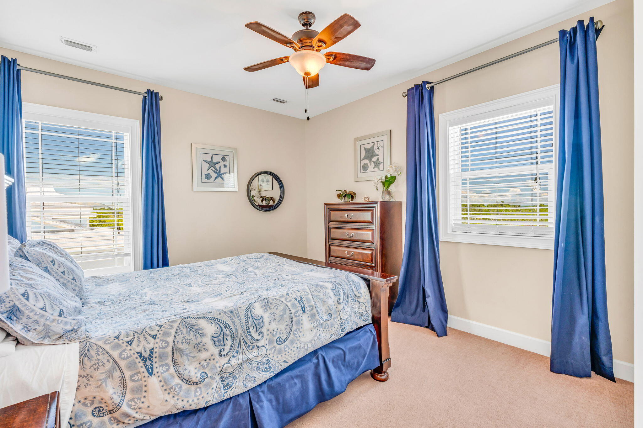 231 Sombrero Beach Road, Unit 1 Marathon, FL 33050 - Photo 21 of 52 a bedroom with a bed and a chandelier
