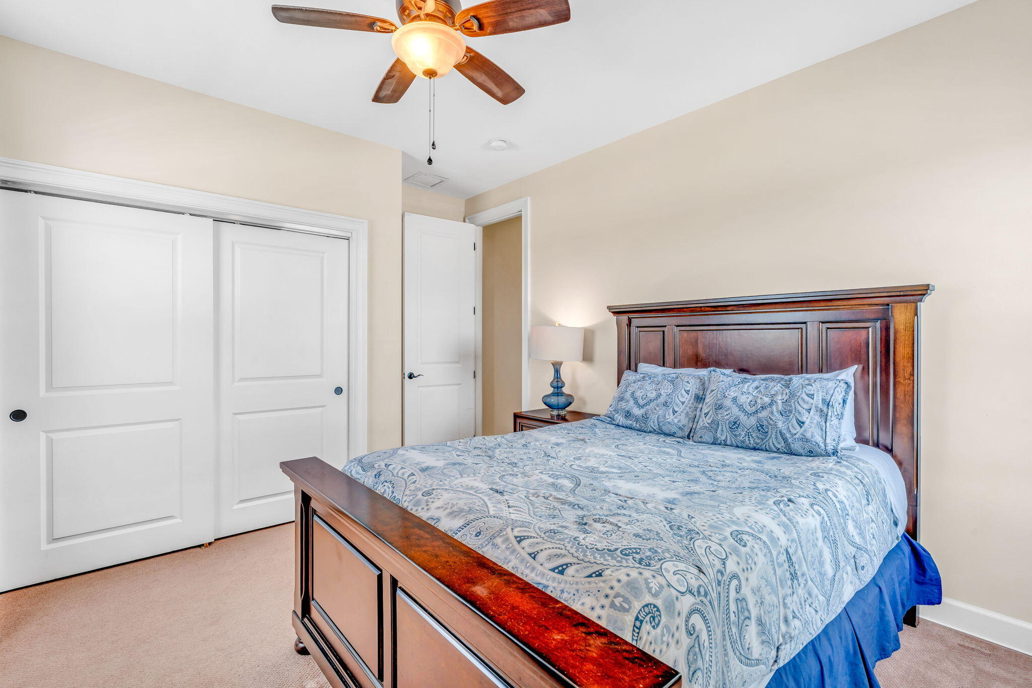 231 Sombrero Beach Road, Unit 1 Marathon, FL 33050 - Photo 22 of 52 a bedroom with a large bed and a chandelier