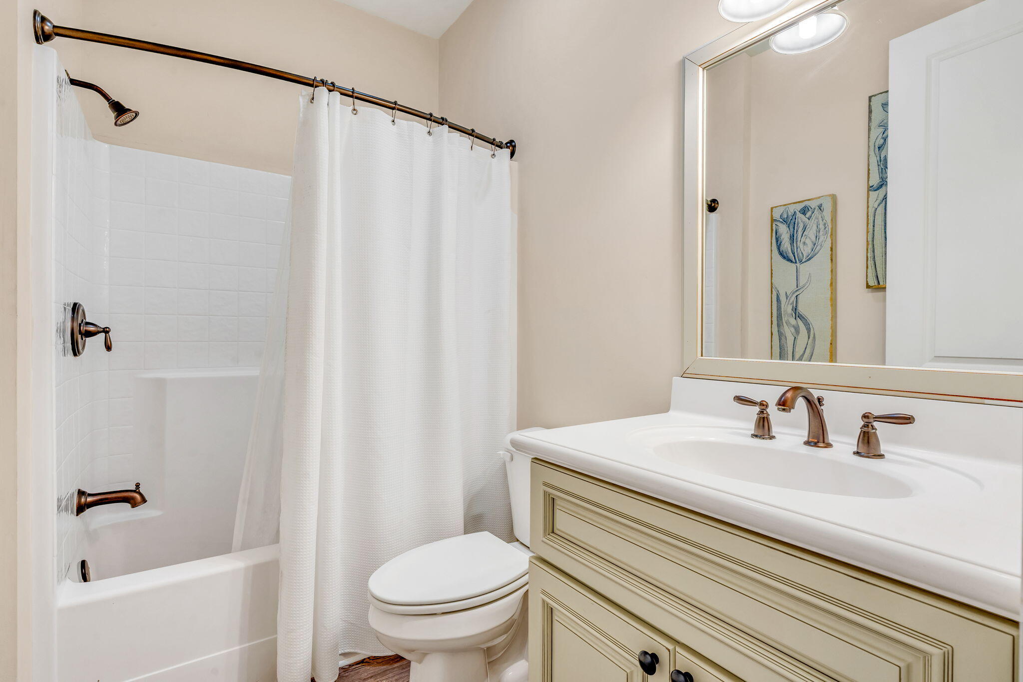 231 Sombrero Beach Road, Unit 1 Marathon, FL 33050 - Photo 25 of 52 a bathroom with a sink a toilet and a mirror