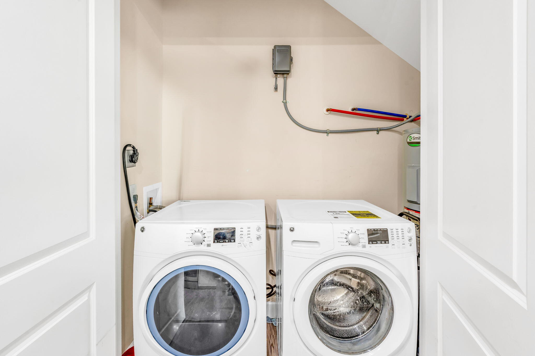 231 Sombrero Beach Road, Unit 1 Marathon, FL 33050 - Photo 27 of 52 a utility room with dryer and washer