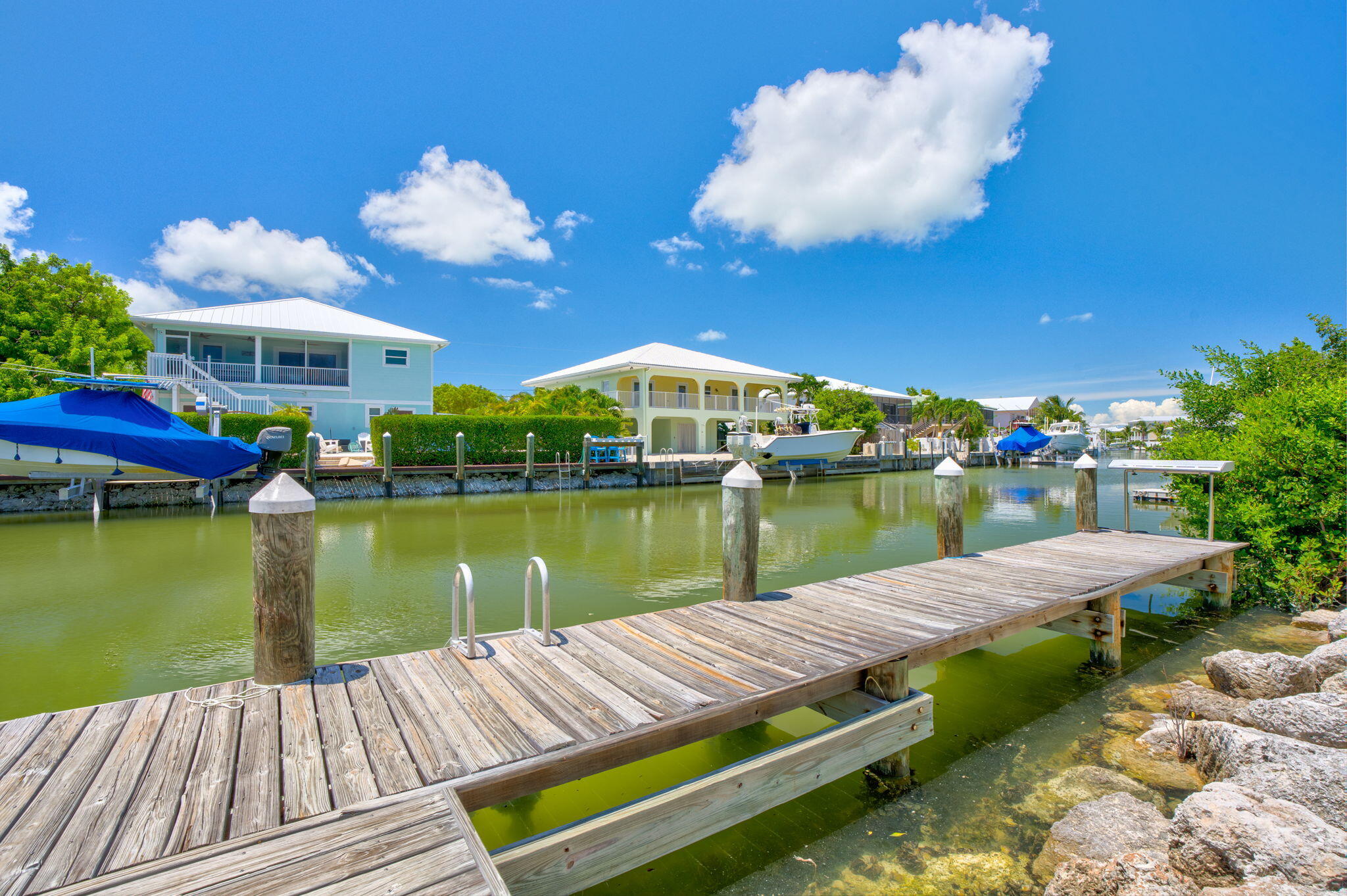 231 Sombrero Beach Road, Unit 1 Marathon, FL 33050 - Photo 33 of 52 a view of a lake with couches and city view