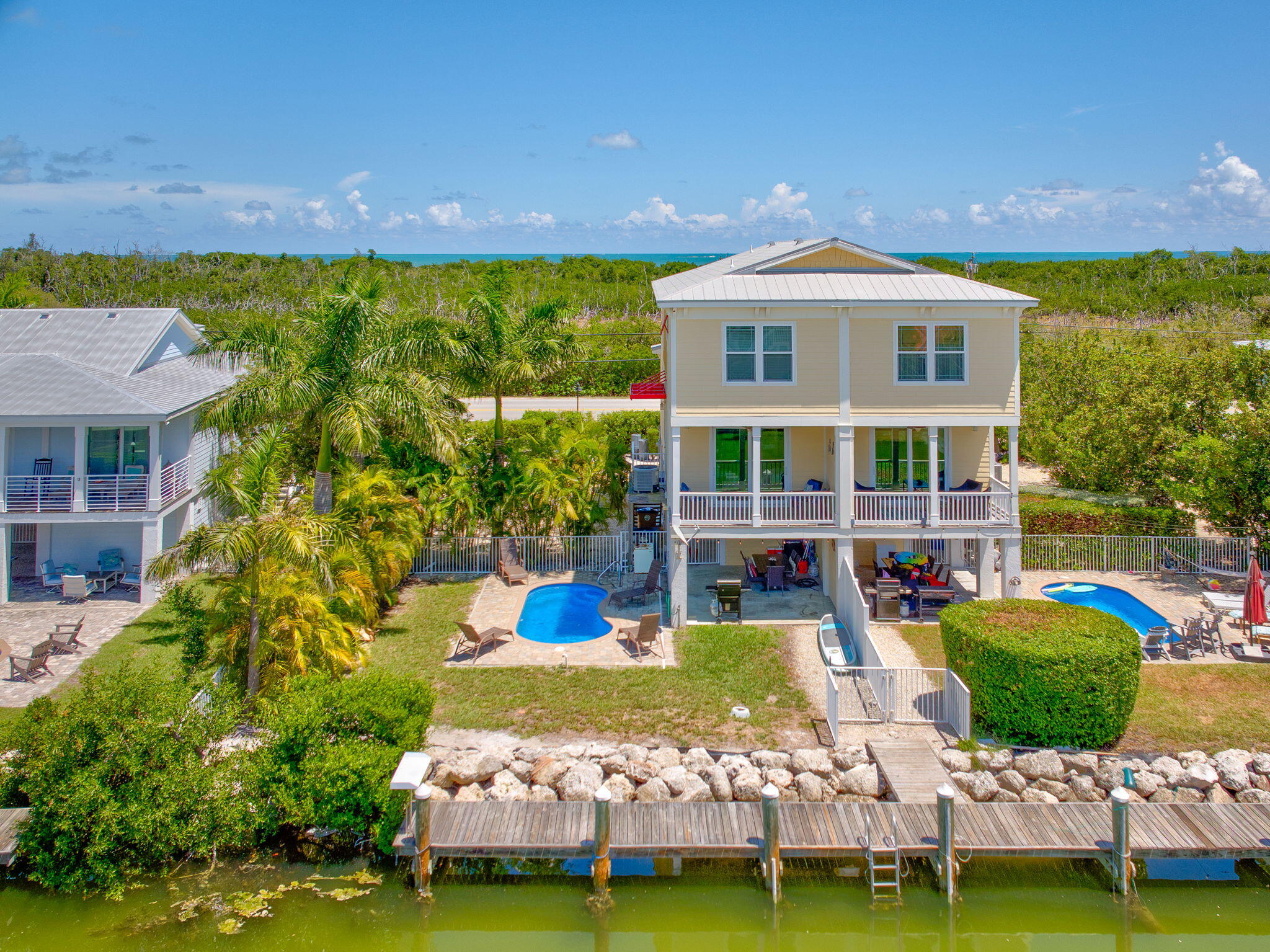 231 Sombrero Beach Road, Unit 1 Marathon, FL 33050 - Photo 37 of 52 a front view of a house with a yard table and chairs