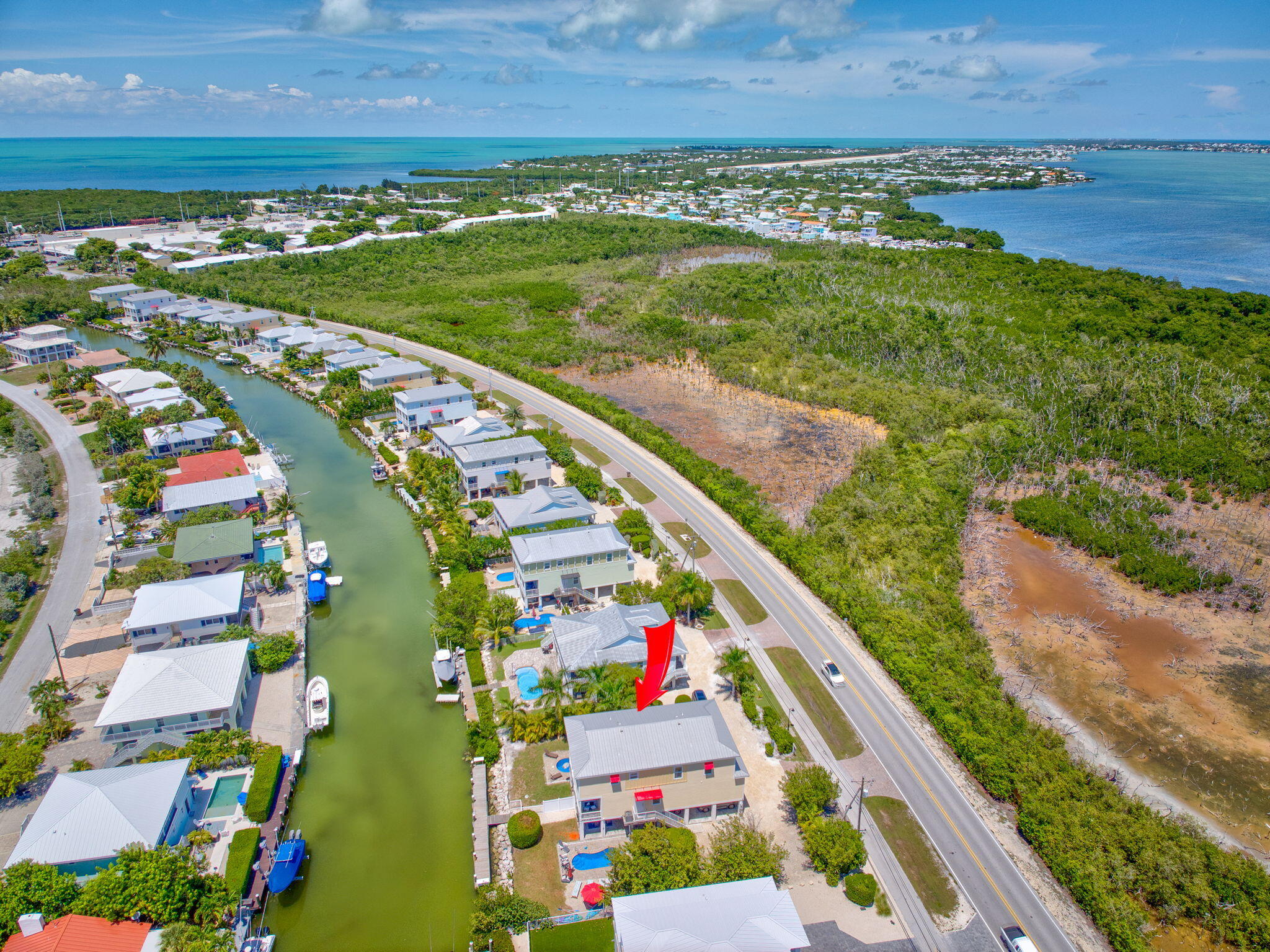 231 Sombrero Beach Road, Unit 1 Marathon, FL 33050 - Photo 48 of 52 a view of a city and an ocean view
