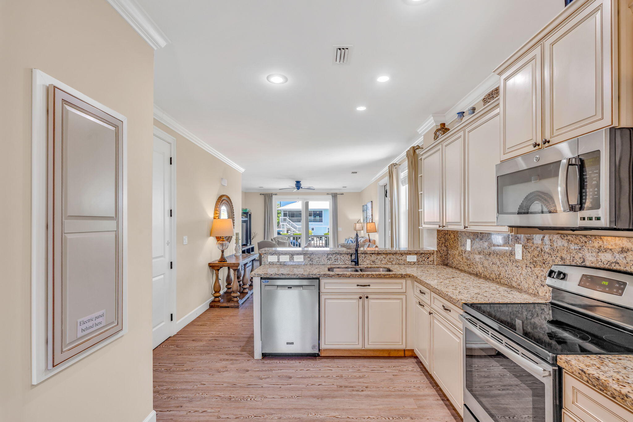 231 Sombrero Beach Road, Unit 1 Marathon, FL 33050 - Photo 7 of 52 a kitchen with stainless steel appliances a sink stove and cabinets