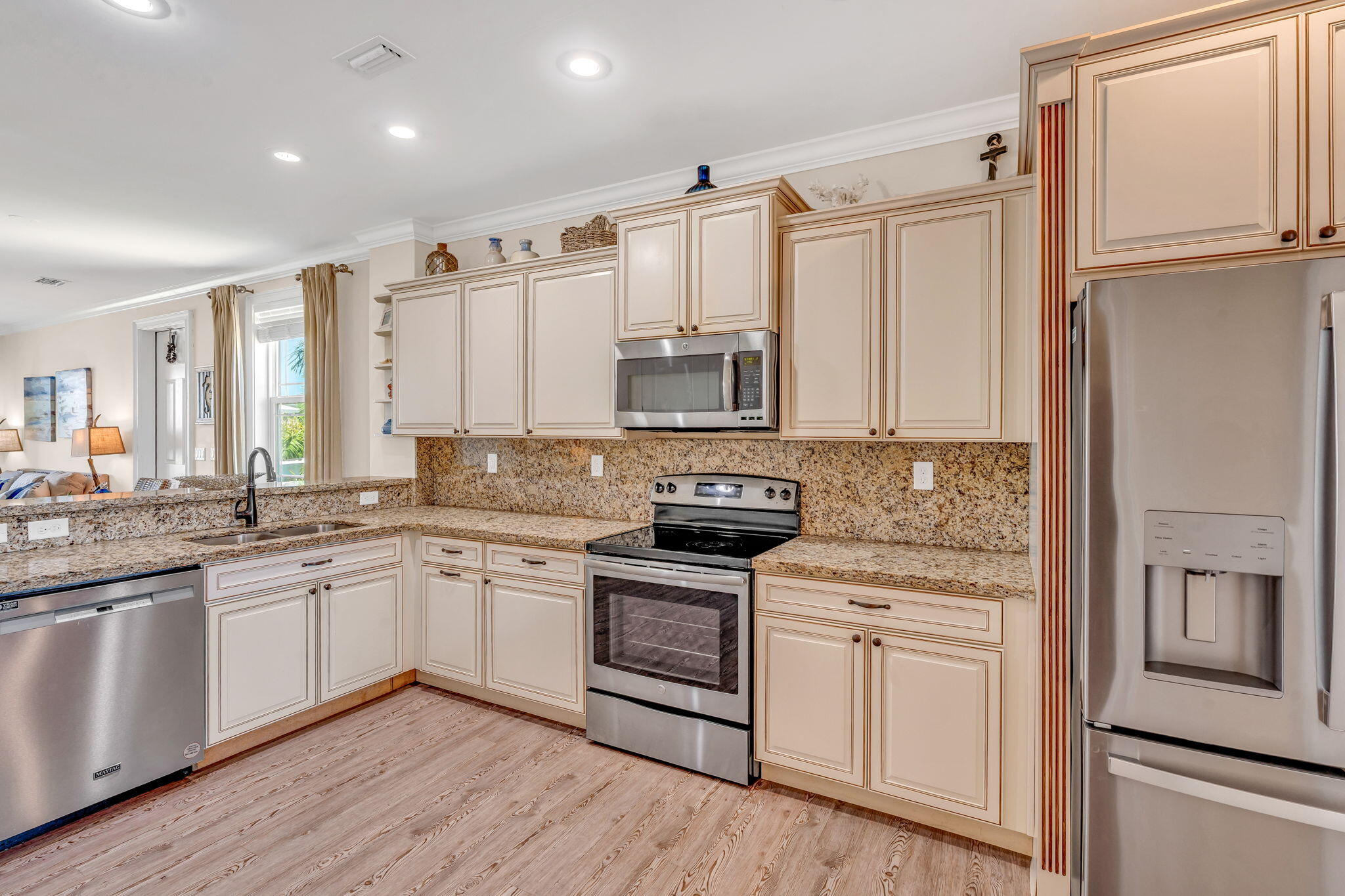 231 Sombrero Beach Road, Unit 1 Marathon, FL 33050 - Photo 8 of 52 a kitchen with stainless steel appliances granite countertop a stove a sink and a refrigerator