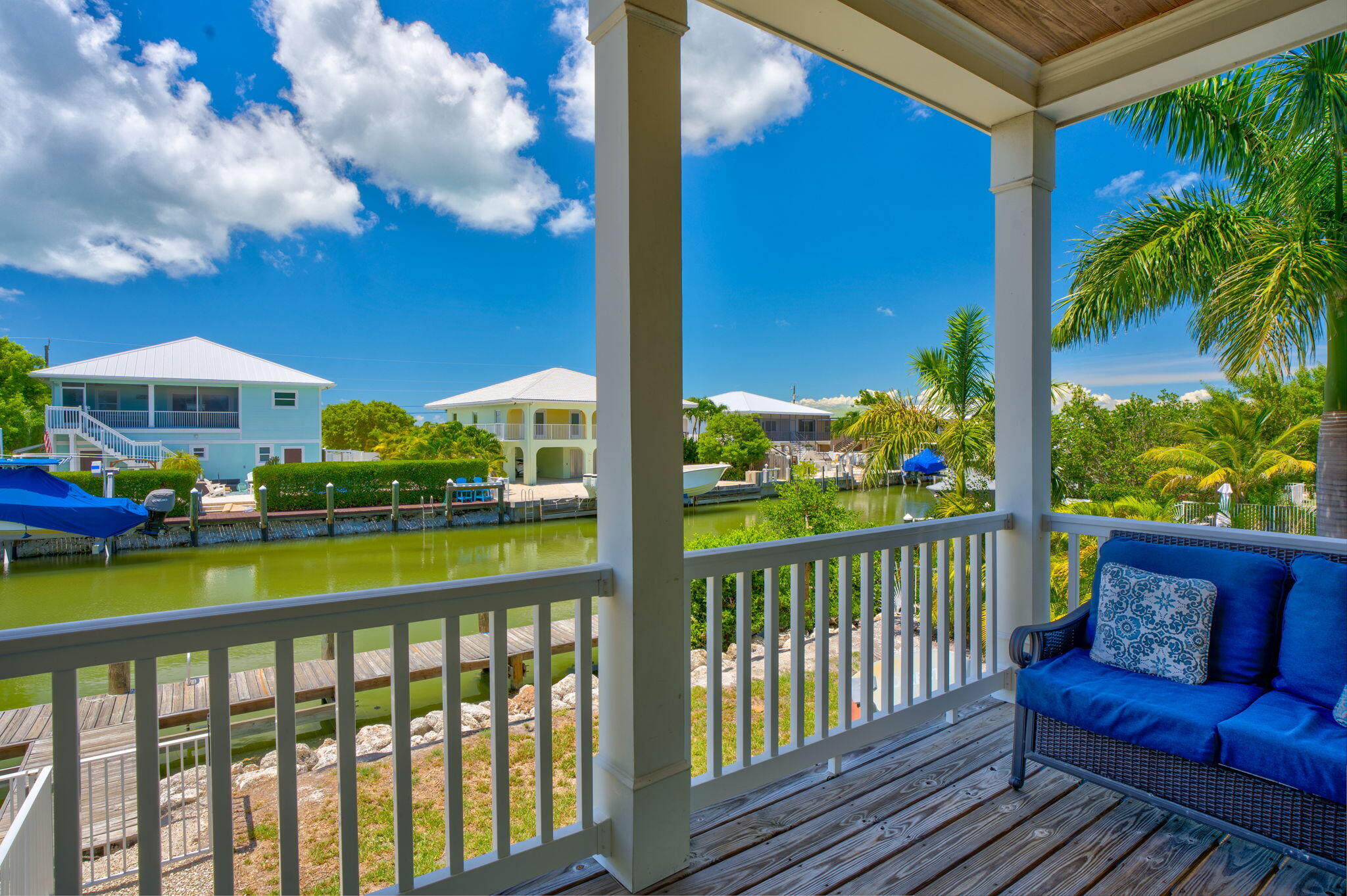 231 Sombrero Beach Road, Unit 1 Marathon, FL 33050 - Photo 10 of 52 a view of a chairs and table in patio with a barbeque grill