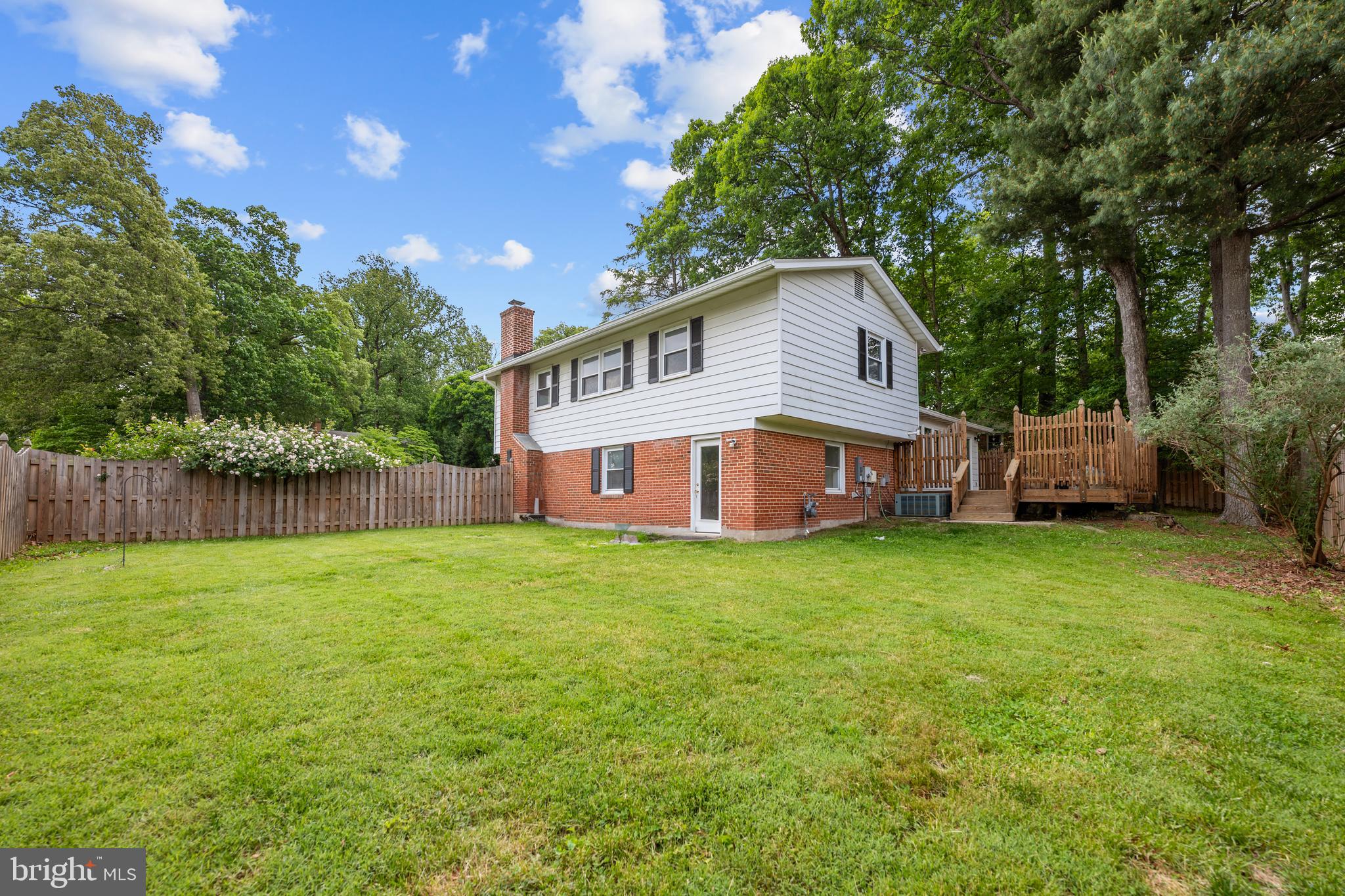 6800 Seton Court Springfield, VA 22152 - Photo 45 of 51 a front view of a house with garden