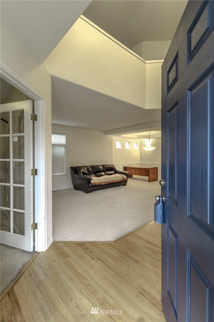 18547 173rd Way Southeast Renton, WA 98058 - Photo 2 of 27 a view of a living room with furniture and a window