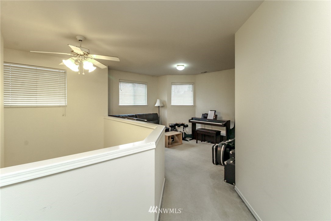 18547 173rd Way Southeast Renton, WA 98058 - Photo 14 of 27 a living room with furniture and a ceiling fan