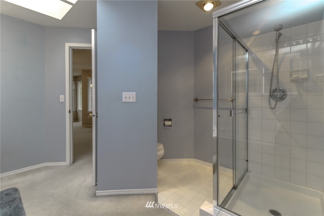 18547 173rd Way Southeast Renton, WA 98058 - Photo 20 of 27 a bathroom with a shower and a toilet