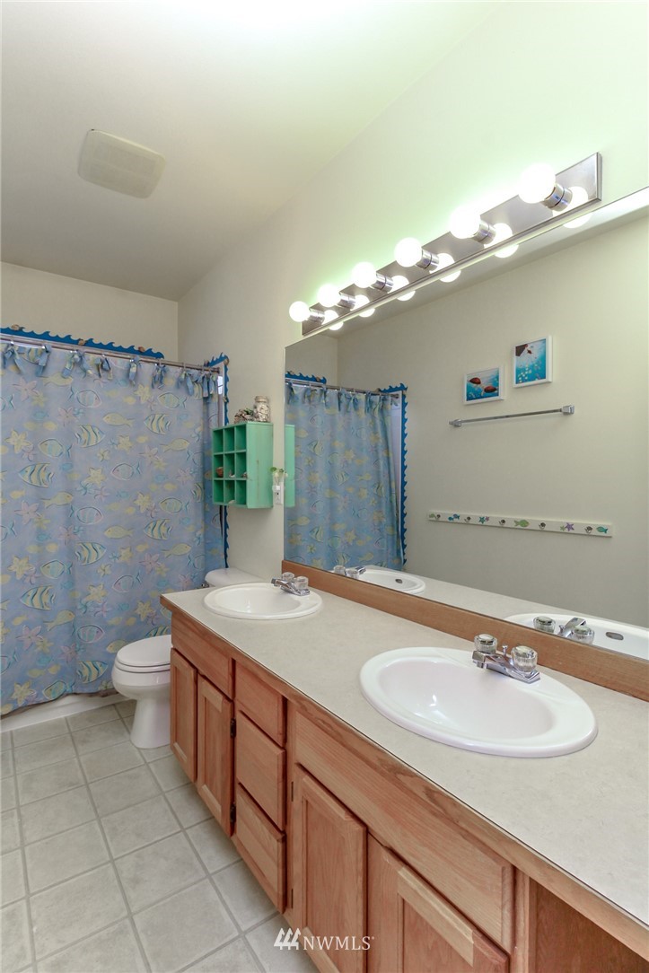 18547 173rd Way Southeast Renton, WA 98058 - Photo 22 of 27 a bathroom with a sink a toilet and shower