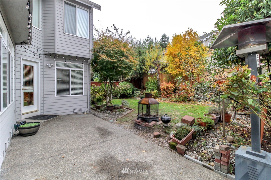18547 173rd Way Southeast Renton, WA 98058 - Photo 25 of 27 a view of a backyard with sitting area and garden
