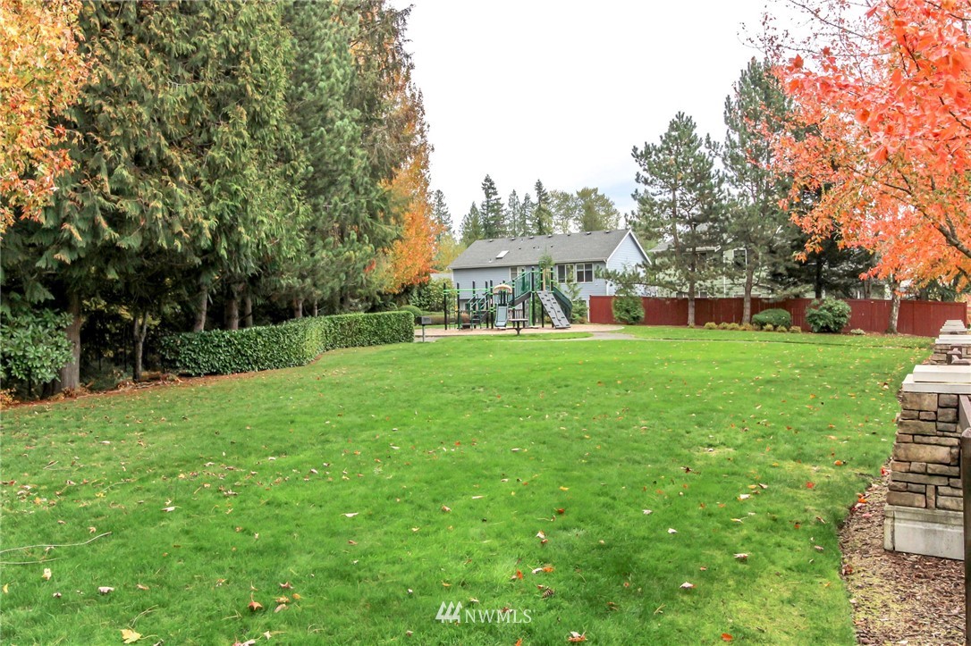 18547 173rd Way Southeast Renton, WA 98058 - Photo 27 of 27 a view of a house with a big yard and large trees