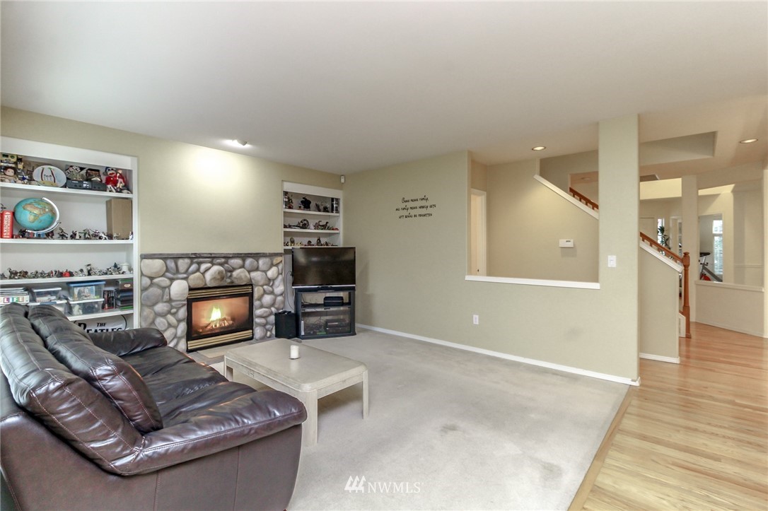 18547 173rd Way Southeast Renton, WA 98058 - Photo 10 of 27 a living room with furniture and a fireplace