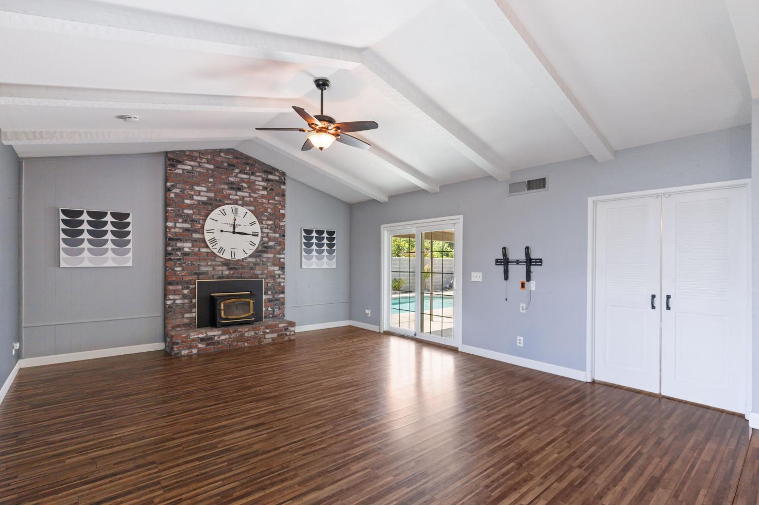 2012 Beverly Avenue Clovis, CA 93611 - Photo 20 of 42 a view of a livingroom with a window and wooden floor