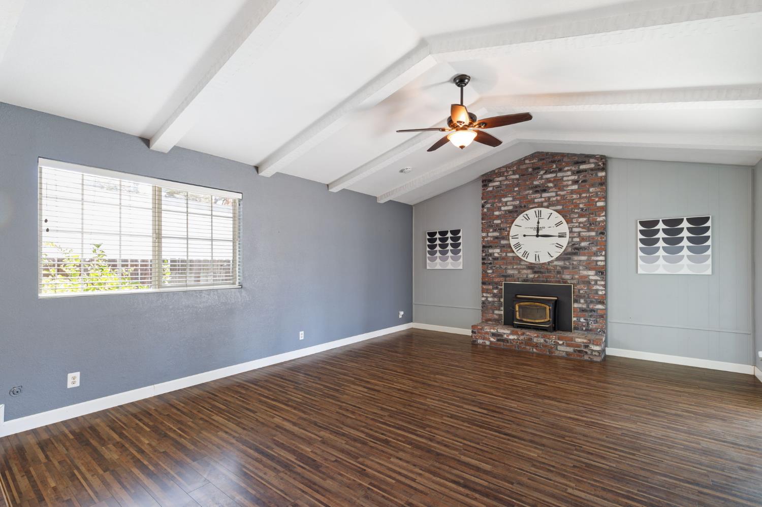 2012 Beverly Avenue Clovis, CA 93611 - Photo 21 of 42 a view of a living room and utility room with wooden floor