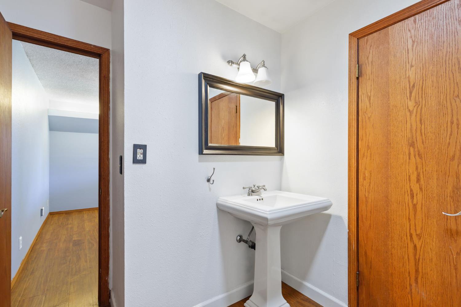 2012 Beverly Avenue Clovis, CA 93611 - Photo 27 of 42 a bathroom with a sink and a mirror