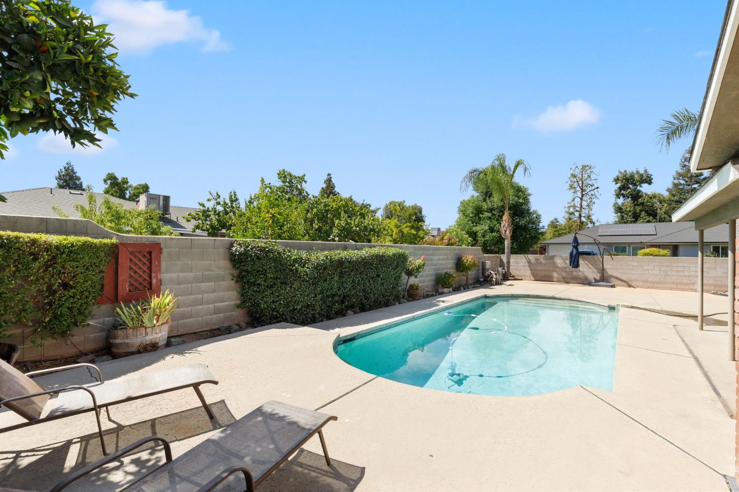 2012 Beverly Avenue Clovis, CA 93611 - Photo 32 of 42 a view of a swimming pool with a patio