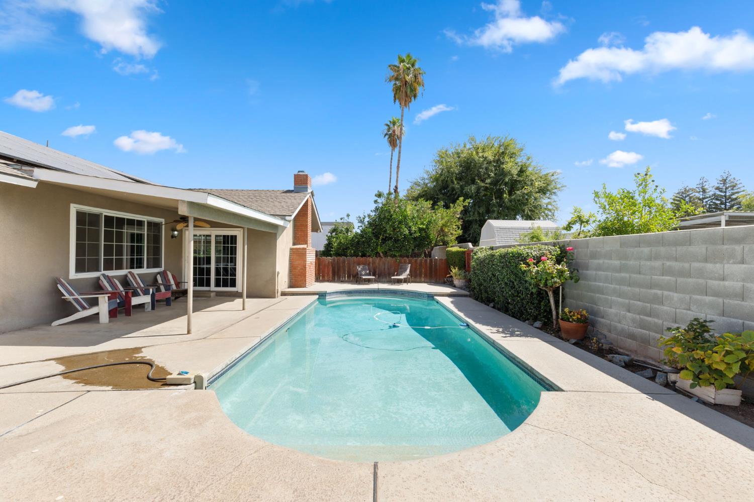2012 Beverly Avenue Clovis, CA 93611 - Photo 34 of 42 a view of a house with backyard sitting area and garden