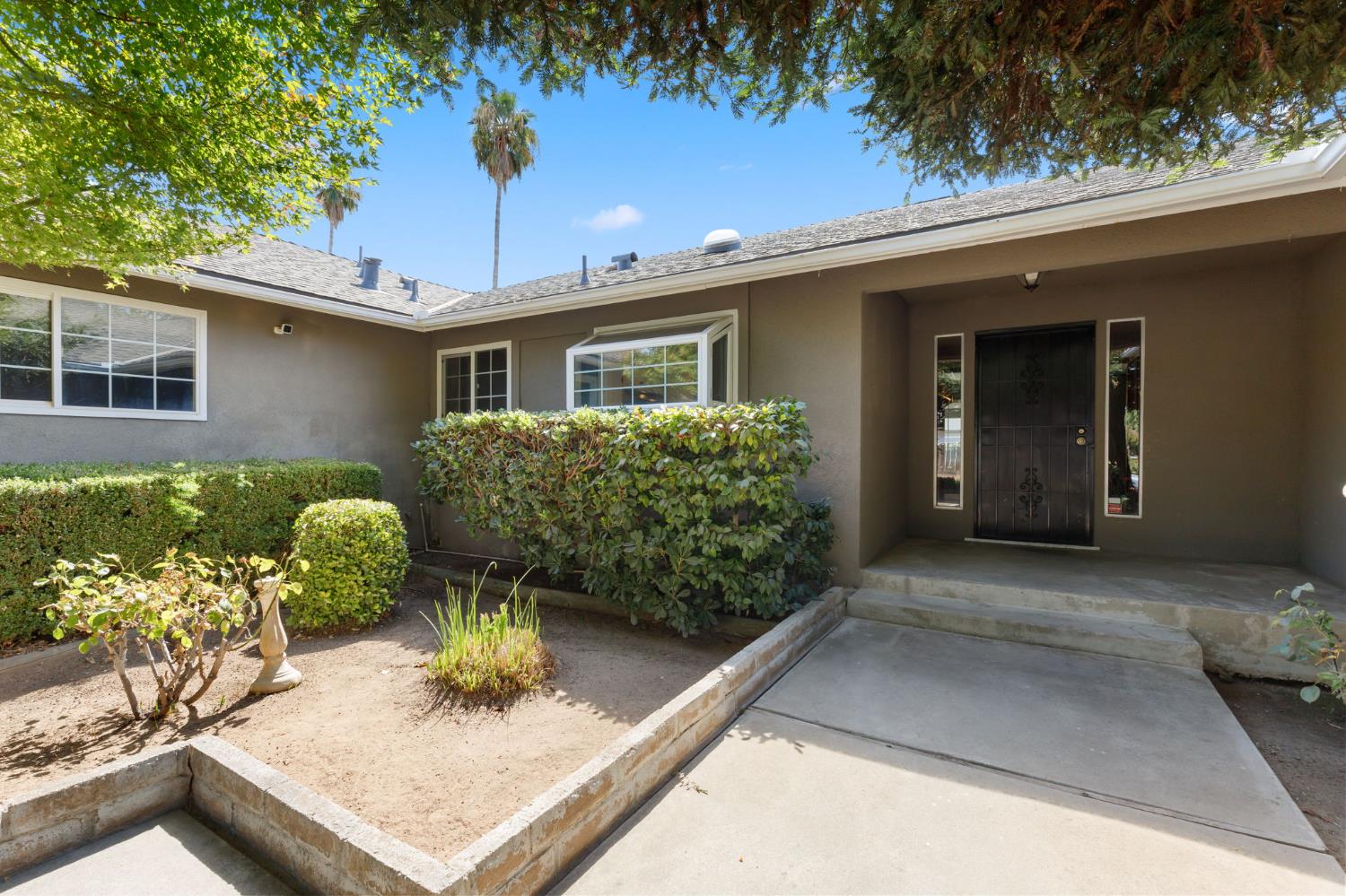 2012 Beverly Avenue Clovis, CA 93611 - Photo 4 of 42 a front view of a house with garden