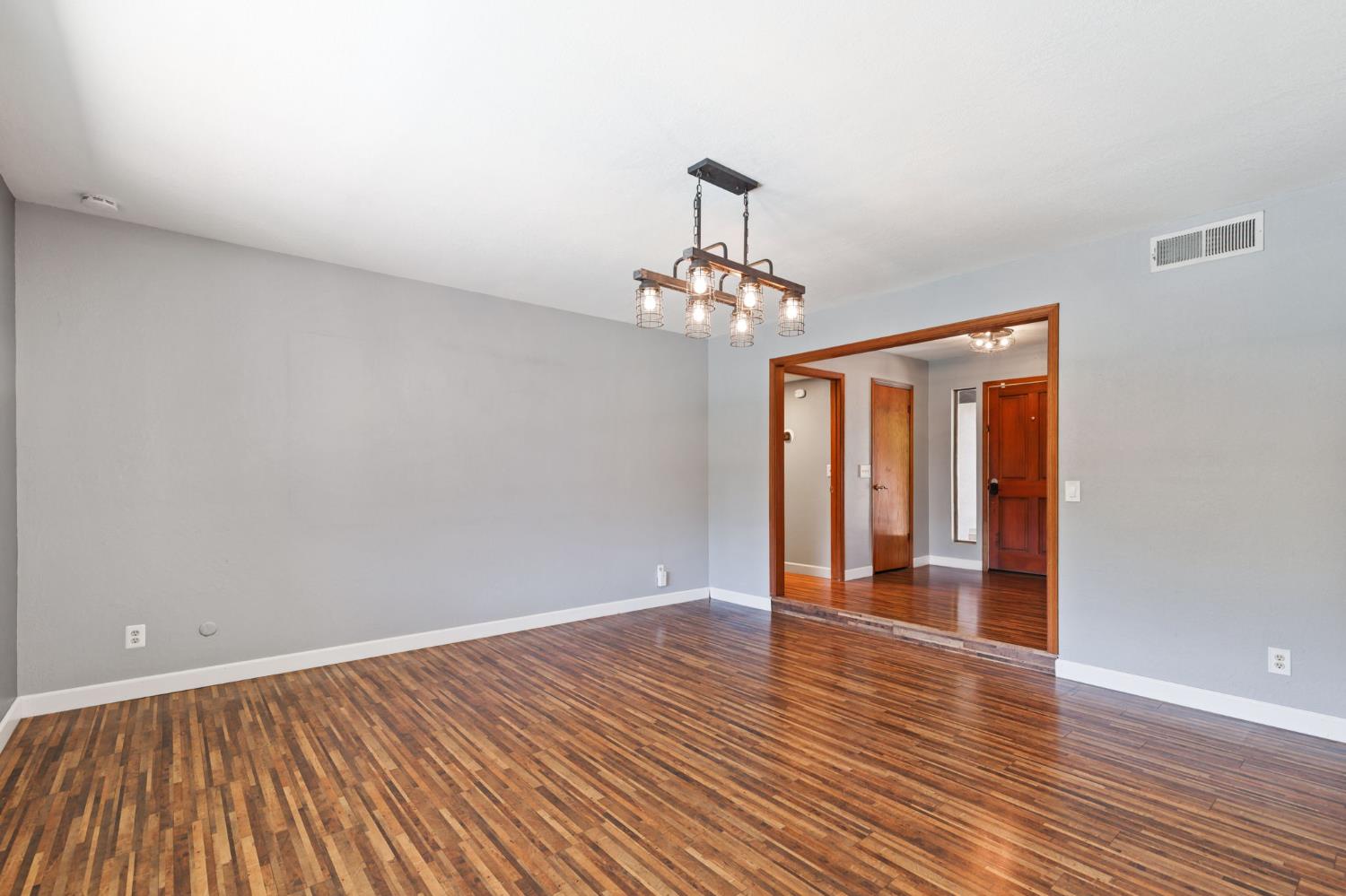 2012 Beverly Avenue Clovis, CA 93611 - Photo 5 of 42 a view of a room with wooden floor and chandelier