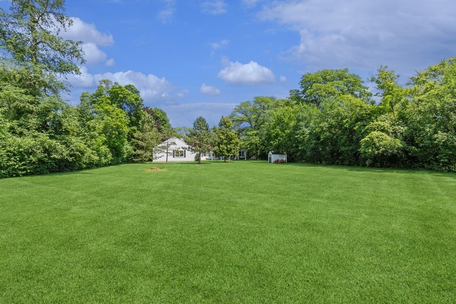 180 Wagner Road Northfield, IL 60093 - Photo 3 of 22 a view of a garden with a pathway