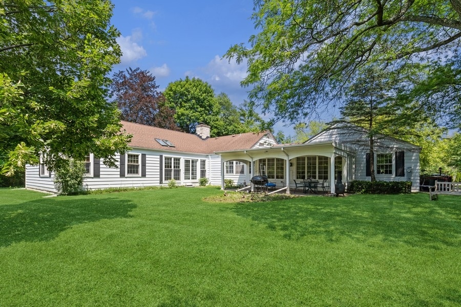 180 Wagner Road Northfield, IL 60093 - Photo 4 of 22 a front view of a house with a garden