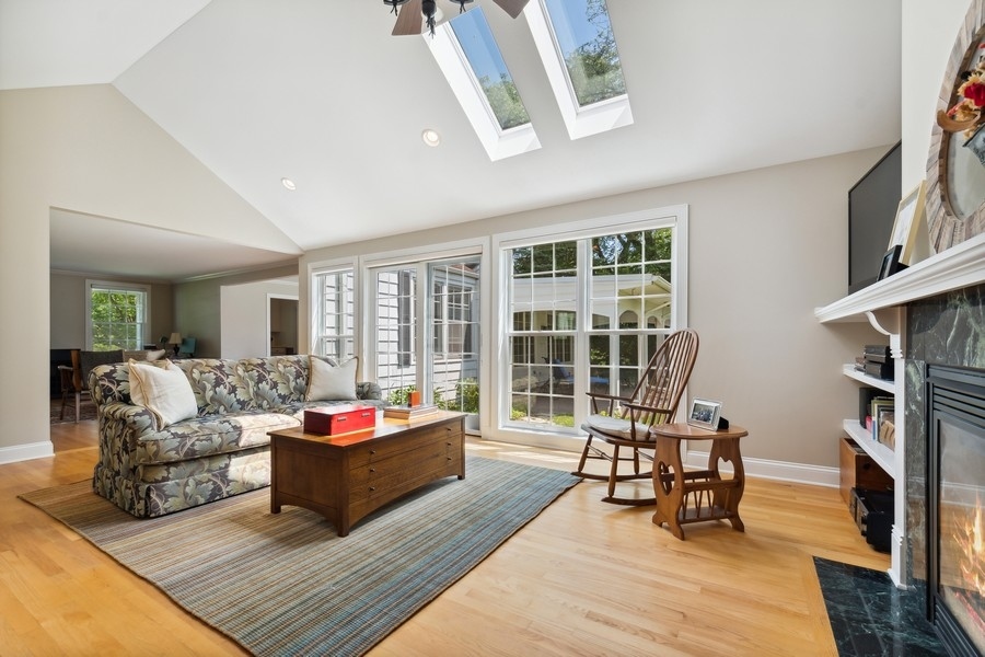 180 Wagner Road Northfield, IL 60093 - Photo 8 of 22 a living room with furniture fireplace and a large window