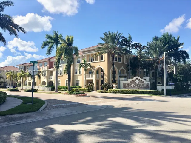 a view of road with palm trees