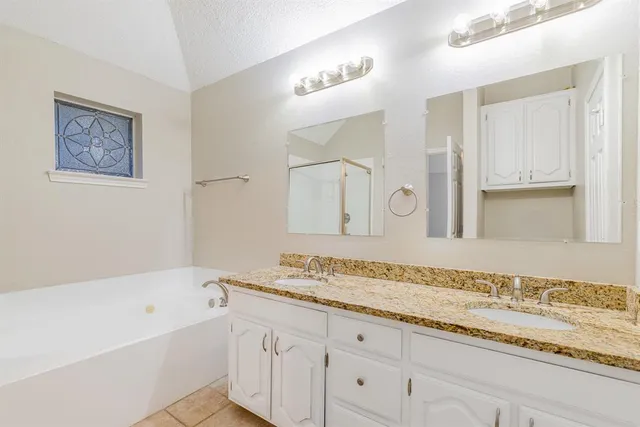 a bathroom with a bathtub and a sink