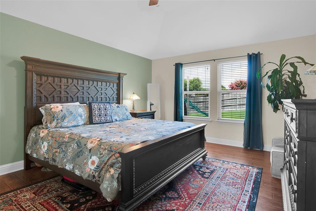 514 Brighton Ct Road Wylie, TX 75098 - Photo 13 of 25 a bedroom with a large bed and a window