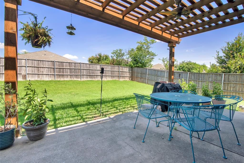 514 Brighton Ct Road Wylie, TX 75098 - Photo 22 of 25 a view of a chairs and table in the patio
