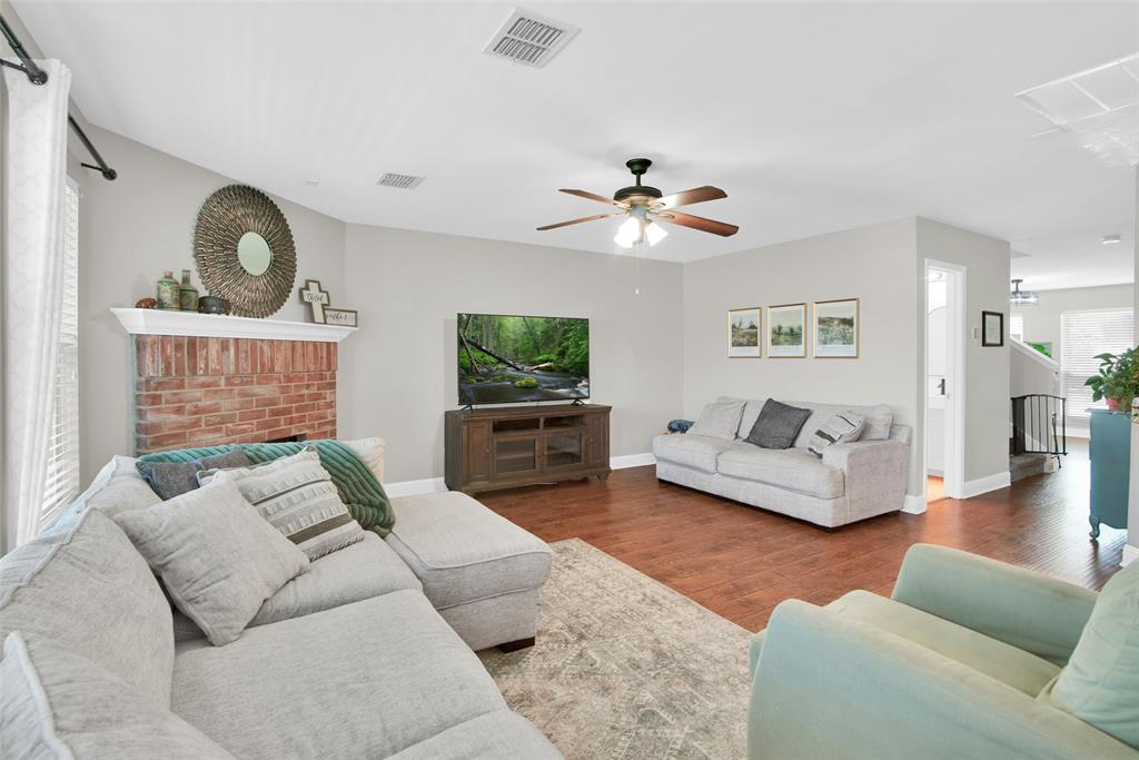 514 Brighton Ct Road Wylie, TX 75098 - Photo 7 of 25 a living room with furniture and a flat screen tv