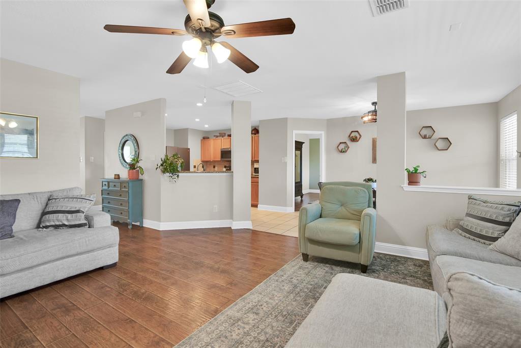 514 Brighton Ct Road Wylie, TX 75098 - Photo 8 of 25 a living room with furniture and a wooden floor