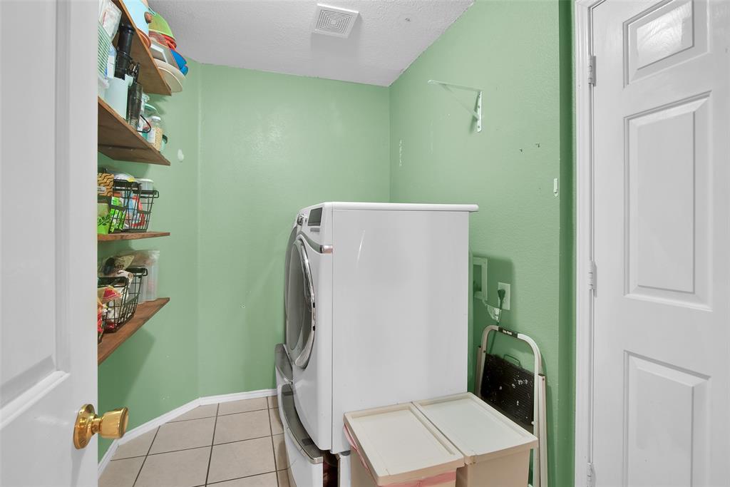 514 Brighton Ct Road Wylie, TX 75098 - Photo 9 of 25 a utility room with dryer and washer