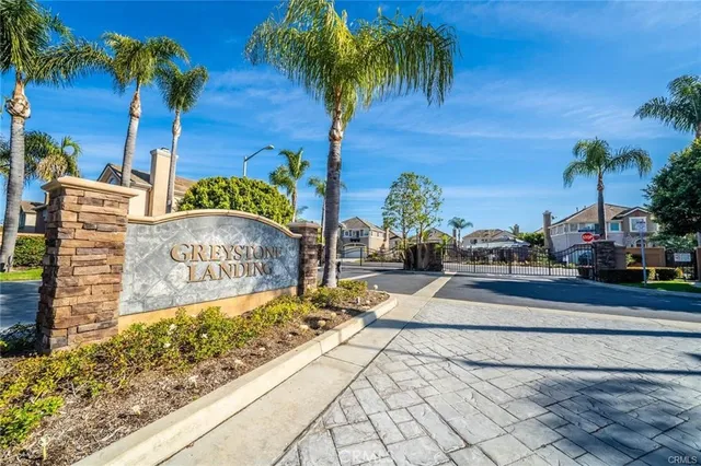 a view of a street with palm trees