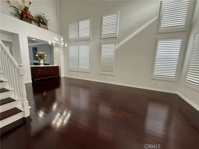 a view of livingroom with furniture wooden floor and windows