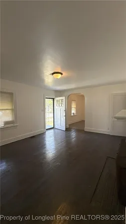 a view of a livingroom with wooden floor