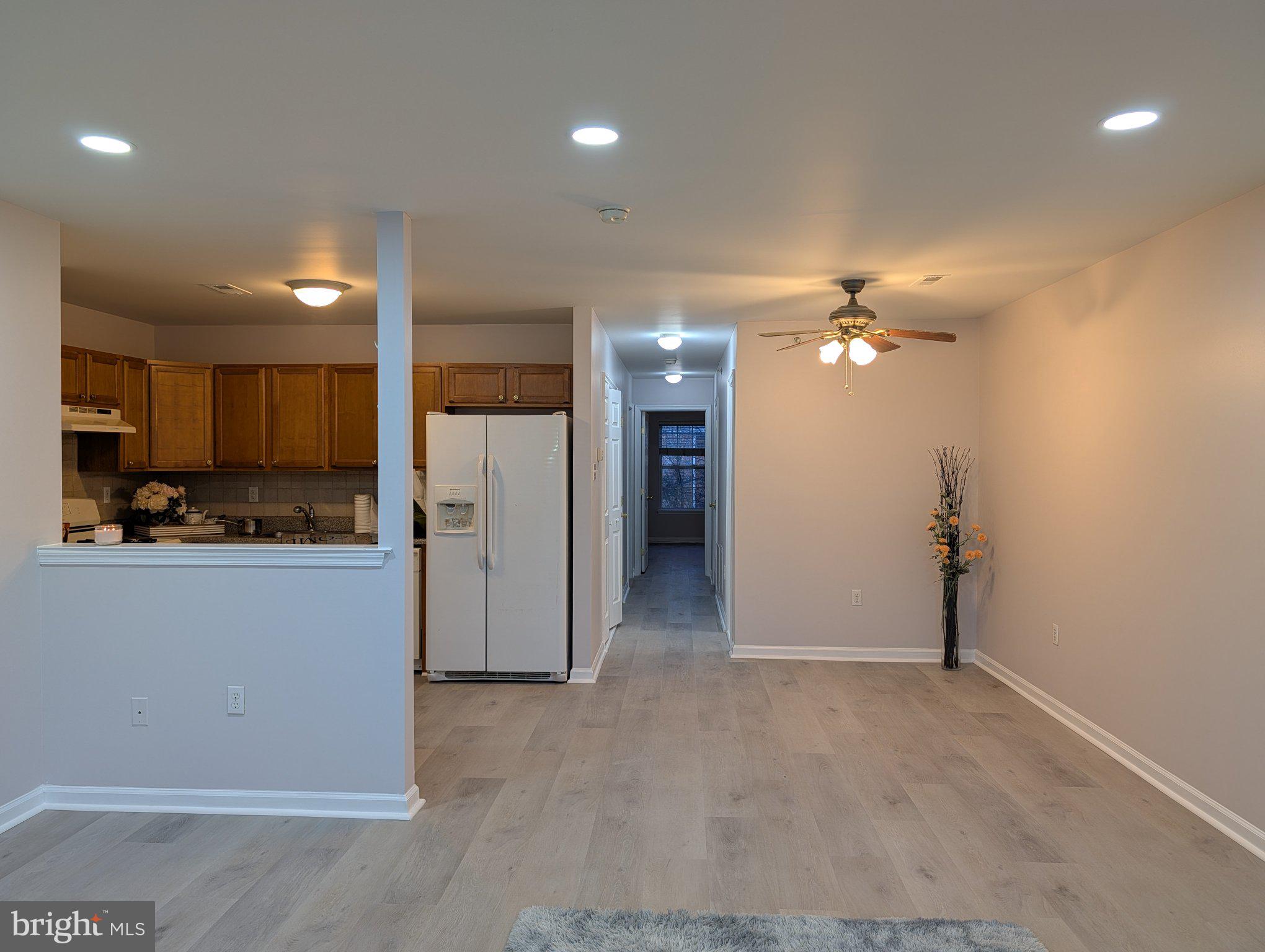 9228 Blue Grass Road, Unit 30 Philadelphia, PA 19114 - Photo 4 of 11 a view of a kitchen with a sink and refrigerator